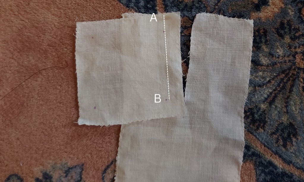 Ompele kainalotilkun ensimmäinen sivu kylkikappaleen halkion reunaan.