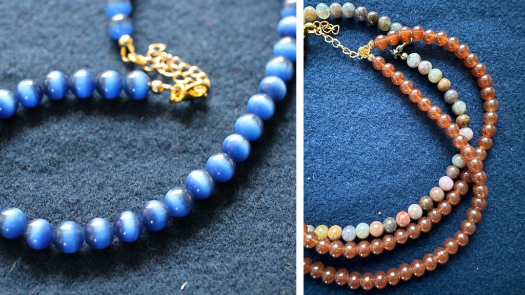 Kissansilmähelmiä sekä kahdet ruskeat helmet.