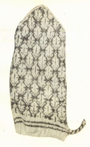 Suunun kirjoille neulottu kinnas.